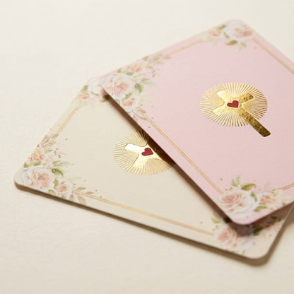 Two decorative greeting cards with floral and parasol designs on a beige background